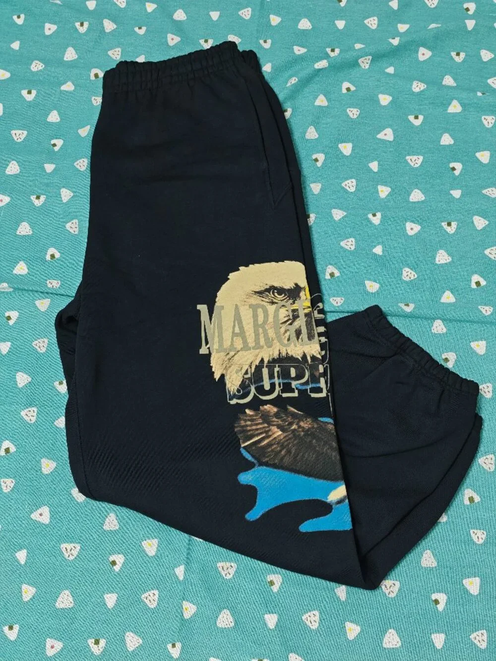 Supreme Black Sweatpants with Eagle Graphic and Tan & Blue Accents